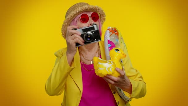 Senior woman granny tourist photographer taking photos on retro camera, travel, holiday vacations - Footage, Video