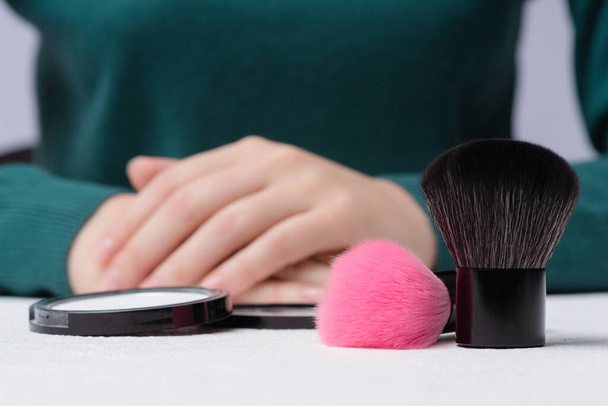 Woman is choosing between natural and synthetic make up brush concept. - Fotoğraf, Görsel