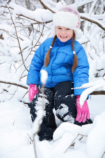 wonderful child in the snowy woods - Фото, изображение