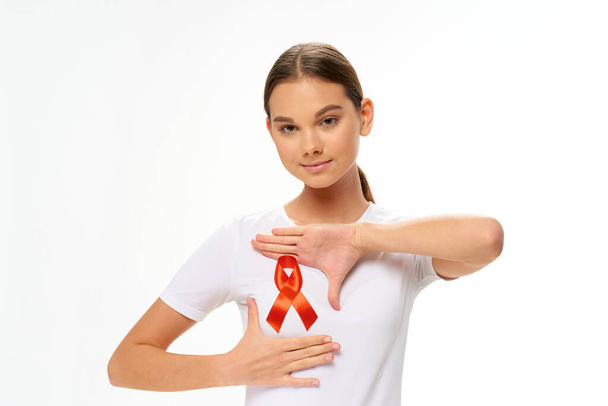 woman wearing white t-shirt ribbon charitable foundation health care - Fotografie, Obrázek