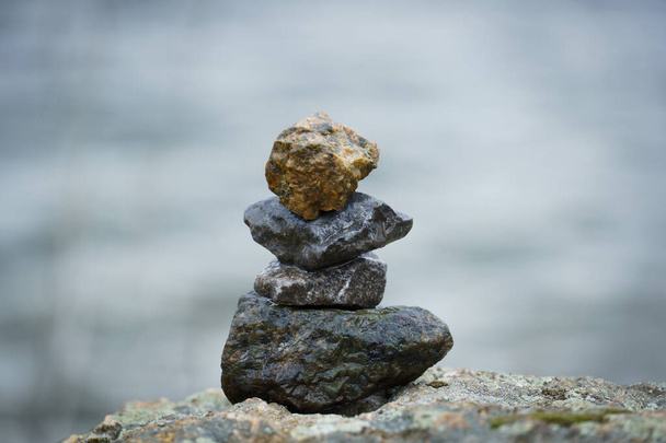 pebbles one by one. the composition of wet rubble is laid on top of each other. positive background on the marine theme - 写真・画像