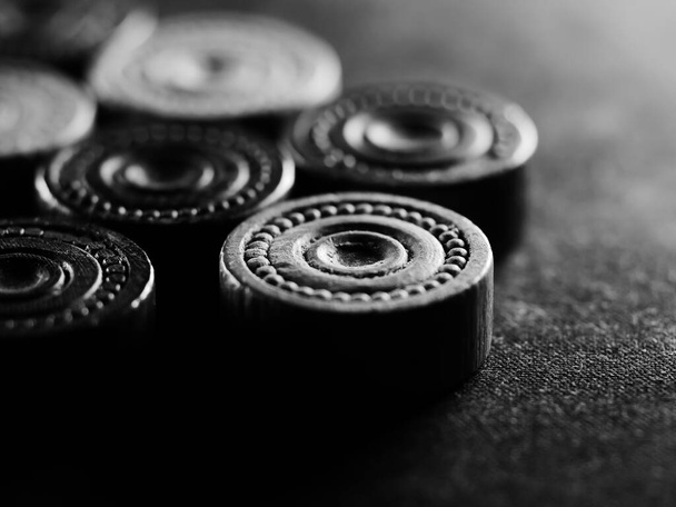 A grayscale shot of draughts pieces - Фото, изображение