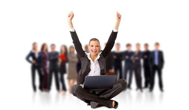 Business woman with her hands raised while working on laptop - Photo, Image
