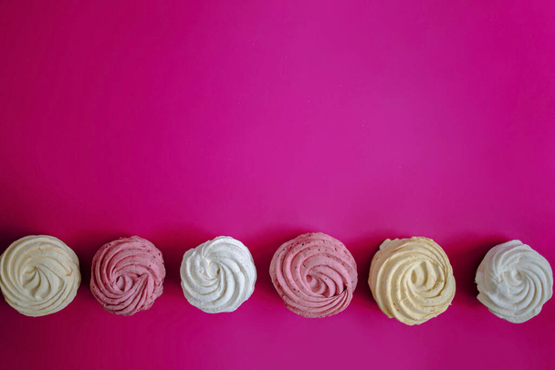 Pink Sweet Homemade Airy Zephyr Or Marshmallows On Pink Background. - Photo, Image