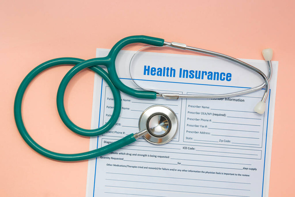 Health insurance with insurance claim form and stethoscope. Health insurance concept - Фото, зображення