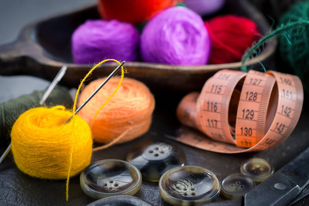 Threads, needles and sewing items. - Фото, изображение