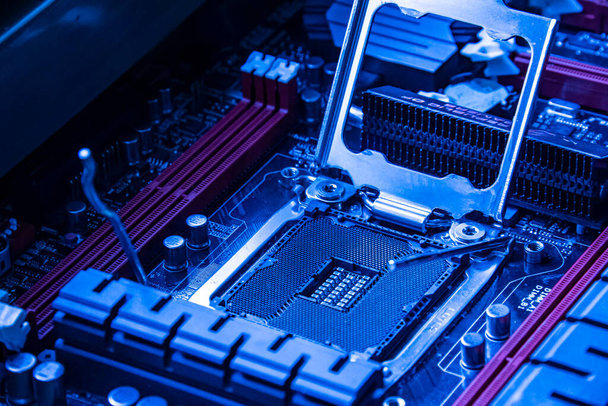 Detail of a Cpu socket in a motherboard of a gaming pc in bluie light - Фото, зображення