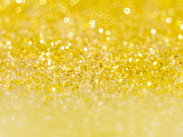 Bright blurred sparkling background. Golden defocused glitter. Shiny bokeh backdrop. - Photo, Image