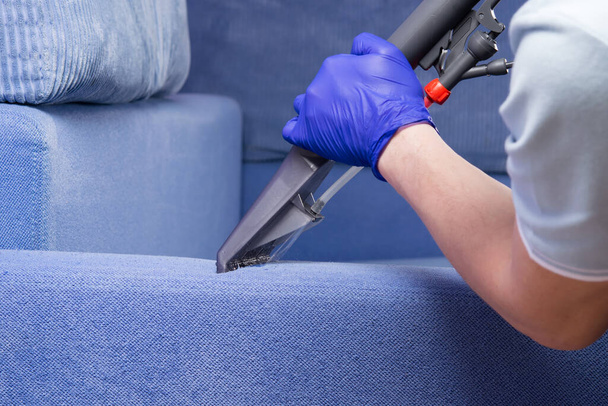 washing vacuum cleaner, cleans the sofa drapery with water - Fotoğraf, Görsel