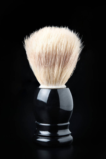 Shaving brush against black background - Fotó, kép