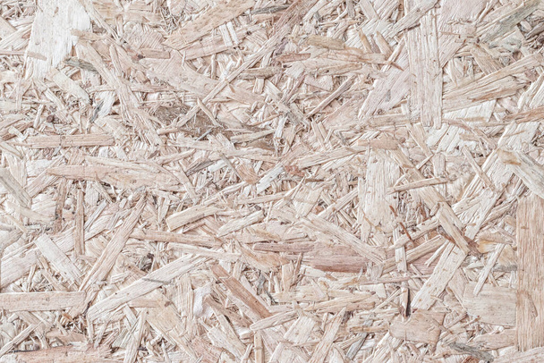 Lastulevy, OSB-suuntautunut säikeislevy lastulevy painetaan kierrätetty puupaneeli tausta rakeinen puinen kuitu kuvio taustan luonnollinen beige ruskea väri - Valokuva, kuva