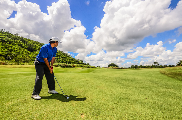 Golfer swinging his gear and hit the golf ball from tee to the f - Photo, Image