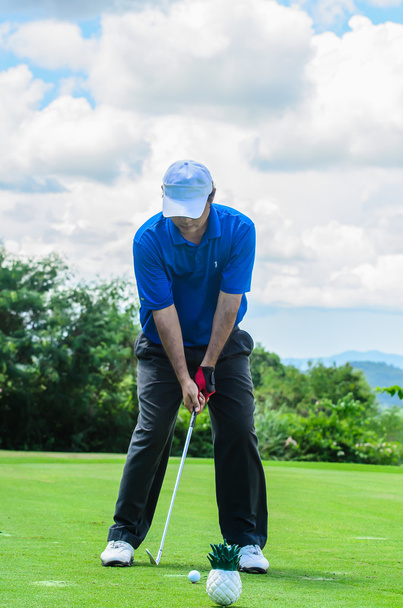 Golfer is ready to swinging his gear and hit the golf ball. - Фото, зображення