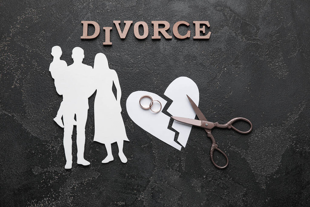 Composition with figures of family and word DIVORCE on dark background - Photo, Image