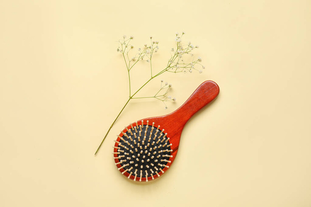 Wooden hair brush on color background - Photo, Image