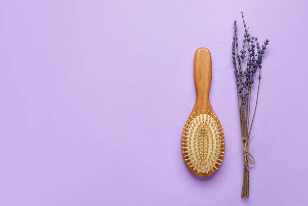 Wooden hair brush on color background - Fotó, kép