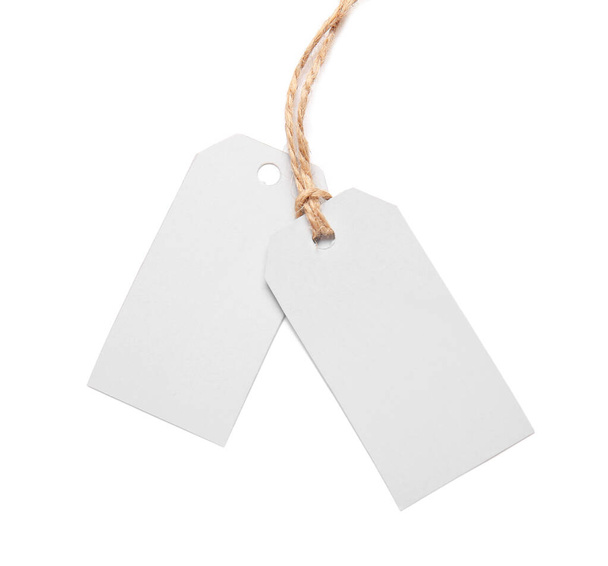 Blank shopping tags on white background - Foto, imagen