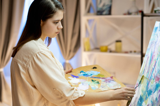 female artist painting process professional art - Photo, Image