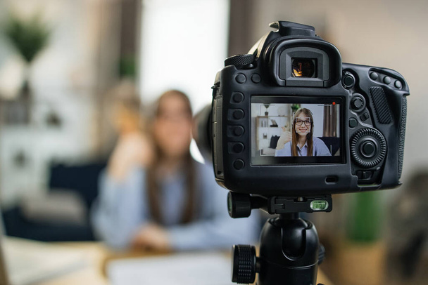 Female influencer using camera for leading live streaming - Fotoğraf, Görsel
