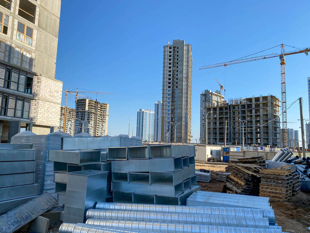 construction of a new multi-storey residential building made of concrete blocks, construction site, sphere of activity related to construction and repair. - Photo, Image
