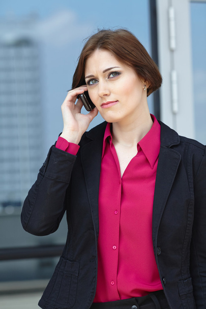 Businesswoman with mobile phone - Foto, afbeelding