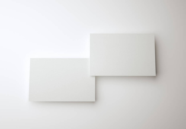 3D-Illustration. Attrappe von zwei leeren weißen Visitenkarten. Vorlage für Visitenkarten-Design. - Foto, Bild