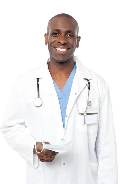 Friendly middle aged male doctor posing - Foto, imagen