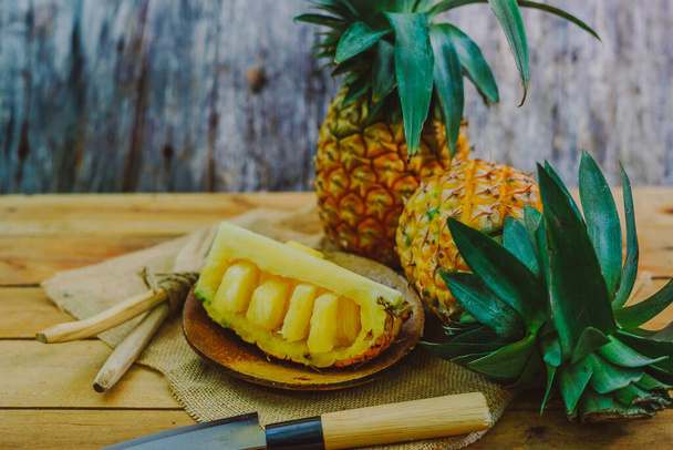 pineapple on the wooden texture background - Fotoğraf, Görsel