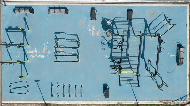 Top down view sports equipments at a public park. Outdoor gym, fitness in the public garden - Photo, Image