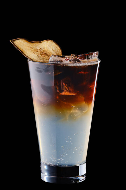 Cold puer and tonic refreshing drink isolated on black background - Фото, изображение