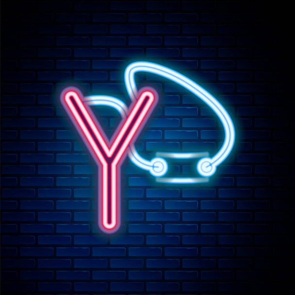 Glowing neon line Slingshot icon isolated on brick wall background. Colorful outline concept. Vector - Vector, Image