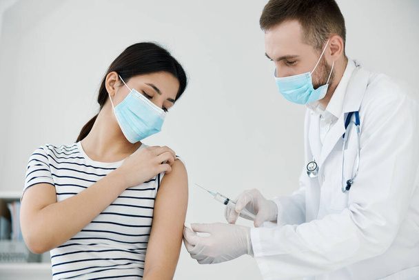 male doctor injects vaccine patients shoulder health coronavirus - Photo, Image
