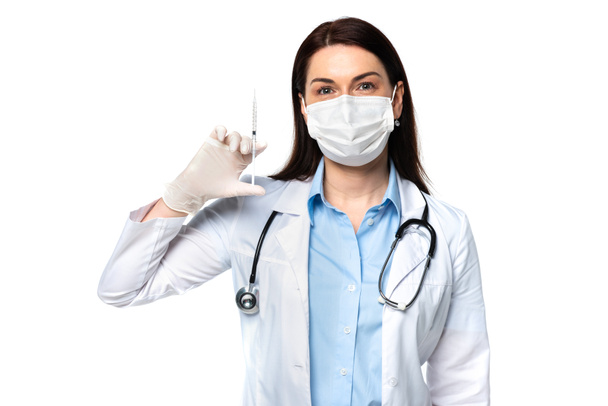 Doctor in latex glove and medical mask holding syringe isolated on white  - Fotografie, Obrázek