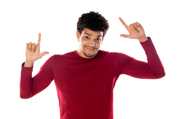 Cute african american man with afro hairstyle wearing a burgundy T-shirt isolated on a white background - Photo, image