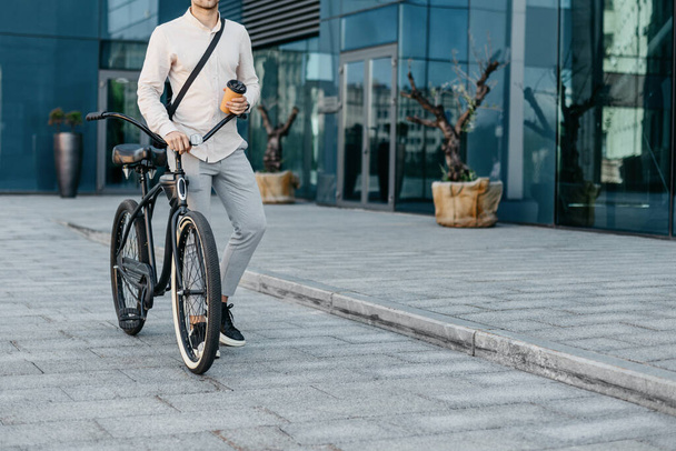 Modern eco transport in city, morning coffee and road to office, outdoor - Photo, Image