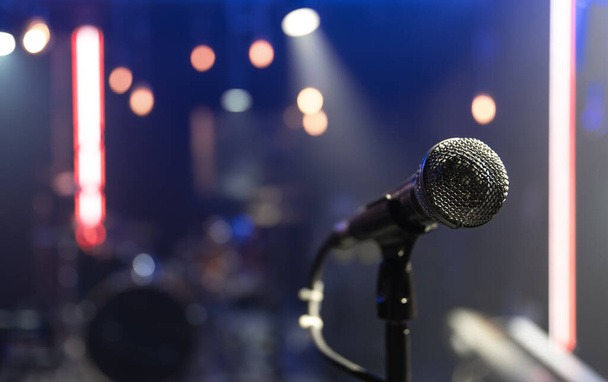 Close up of a microphone on a concert stage with beautiful lighting. - Photo, Image