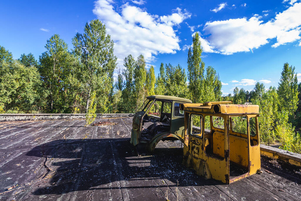 Wrecks on a roof of police station in Pripyat abandoned city in Chernobyl Exclusion Zone, Ukraine - Photo, Image