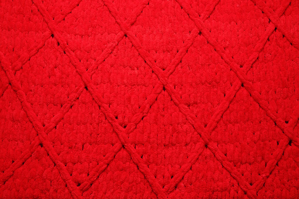 Red woolen fabric with geometrical pattern as background, top view - Zdjęcie, obraz