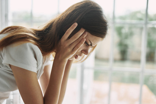 woman at home holding her head loneliness depression - Photo, Image