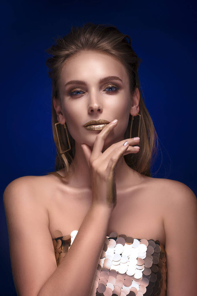 Magic Girl Portrait in Gold. Golden Makeup, close-up portrait in - Фото, изображение