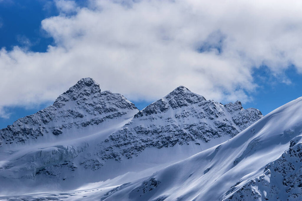 Snowy Kogutai mountains in winter day. Great Caucasus Range, Elbrus region, Russia - Fotó, kép