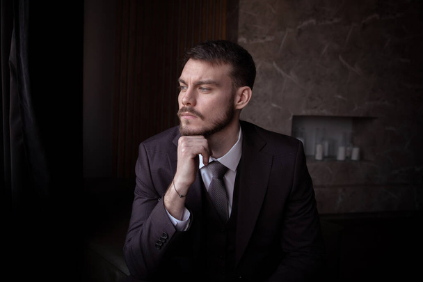 portrait of a brutal young man with a beard. business. success - Фото, изображение