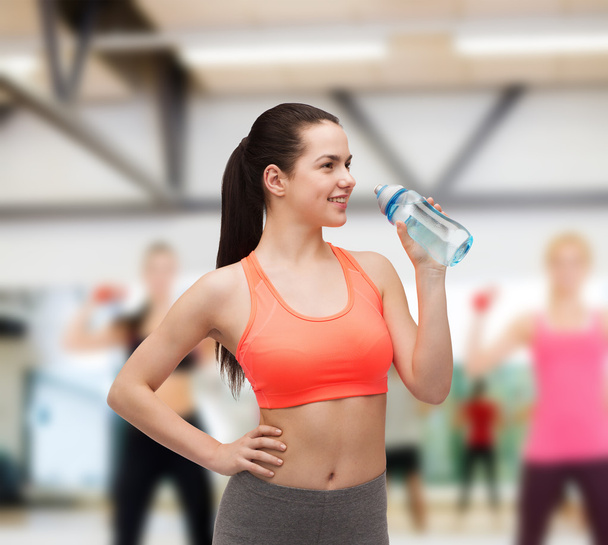 sporty woman with water bottle - Photo, Image
