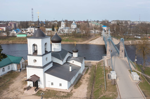 Drone view of the unique chain bridge and St. Nicholas Church in the town of Ostrov, Pskov region. - Photo, Image