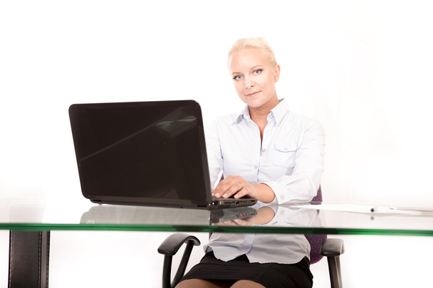 Blonde secretary working on a laptop	 - Φωτογραφία, εικόνα