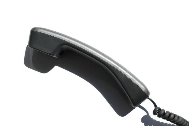 Auricular desde un teléfono fijo sobre un fondo blanco - Foto, Imagen
