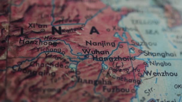 Wuhan City and China Map at an Old Earth Globe Map. Close Up.   - Footage, Video