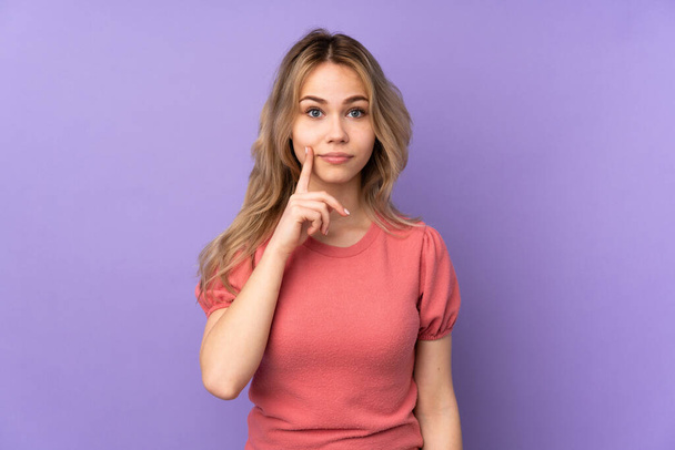Teenager Russian girl isolated on purple background and looking front - Foto, immagini