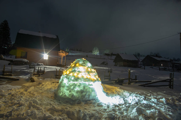Snow igloo at night in the Carpathian mountains - Photo, Image