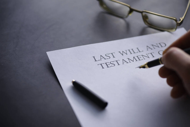 Legal concept. The procedure for writing the last will. Papers with testament on table. Registration of the last will and testament. - Photo, Image